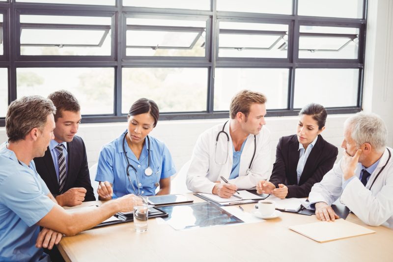 Medical team interacting with each other in conference room